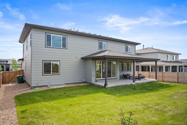 14391 Shasta Daisy Pt, Parker, CO 80134 - rear view of property with a patio area