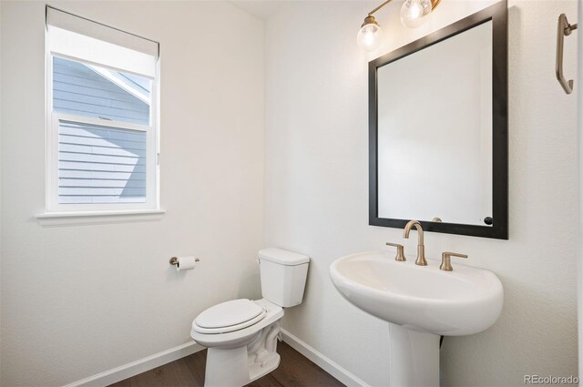 14391 Shasta Daisy Pt, Parker, CO 80134 - bathroom with wood finished floors, baseboards, and toilet