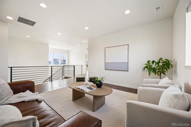 14391 Shasta Daisy Pt, Parker, CO 80134 - living room featuring wood finished floors, recessed lighting, and baseboards