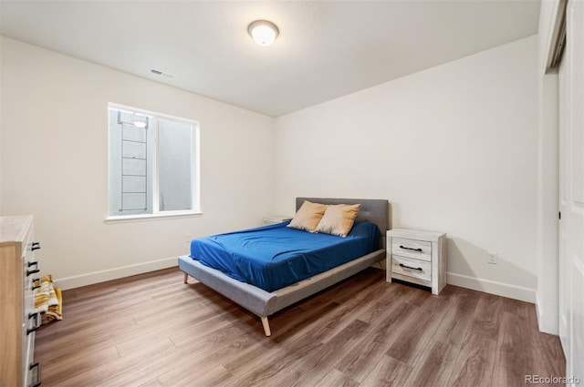 14391 Shasta Daisy Pt, Parker, CO 80134 - bedroom featuring wood finished floors and baseboards
