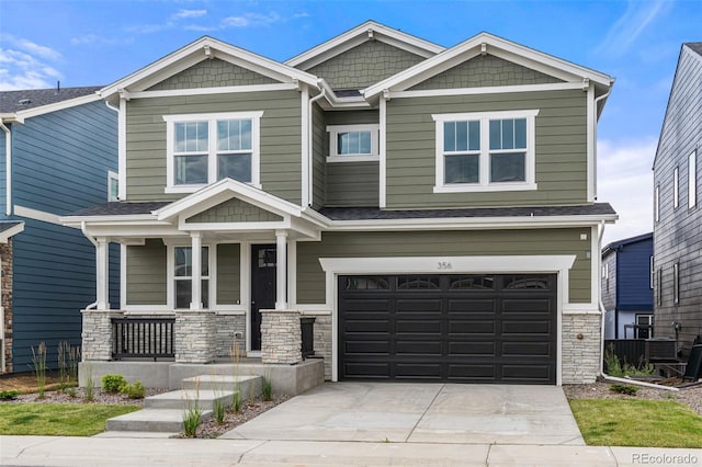 craftsman-style house featuring a porch and a garage