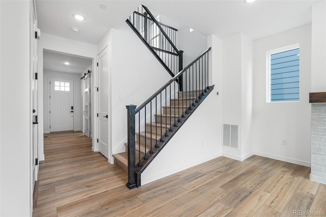 stairway with wood-type flooring