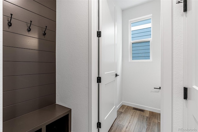 mudroom with light hardwood / wood-style flooring