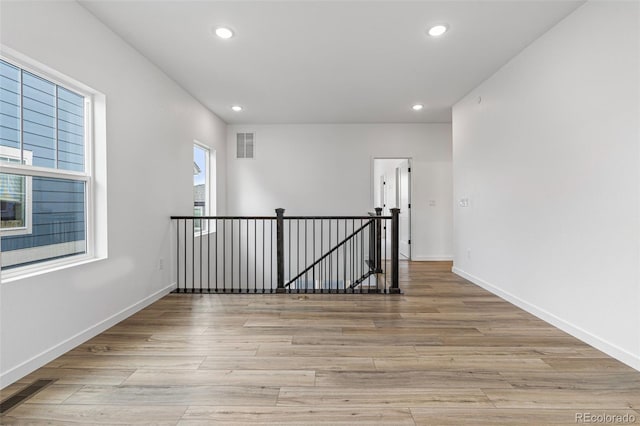 spare room featuring light hardwood / wood-style floors