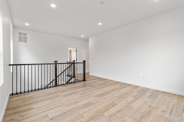 unfurnished room featuring light wood-type flooring