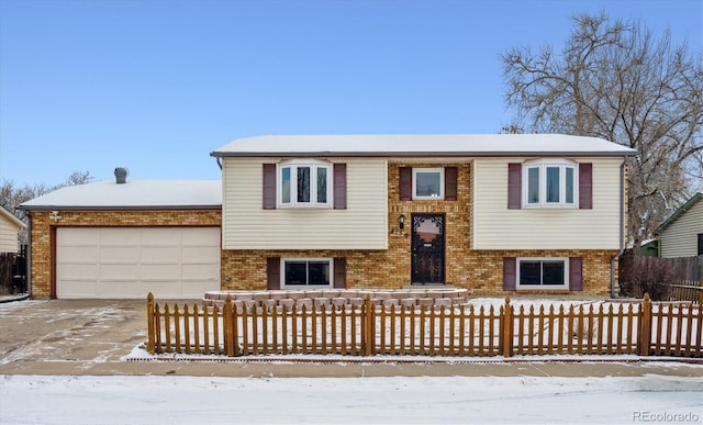 bi-level home featuring a garage