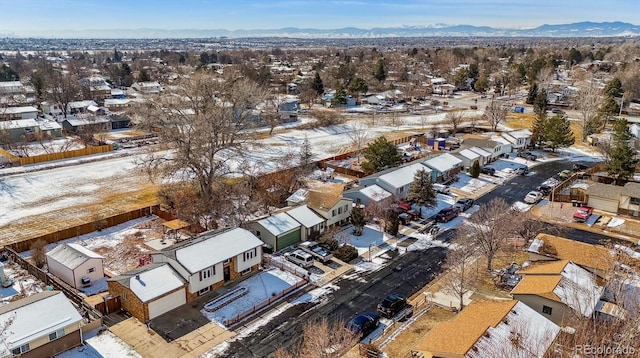 snowy aerial view with a mountain view