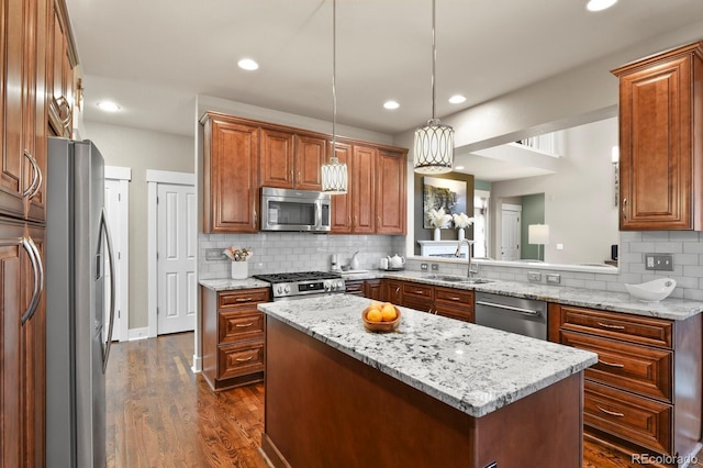 8741 E 29th Ave, Denver, CO 80238 - kitchen featuring a sink, brown cabinets, dark wood-style flooring, backsplash, and appliances with stainless steel finishes