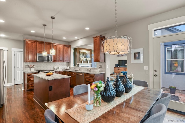 8741 E 29th Ave, Denver, CO 80238 - dining space with dark wood-style floors and recessed lighting
