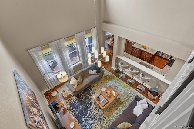 8741 E 29th Ave, Denver, CO 80238 - living area featuring wood finished floors and a towering ceiling
