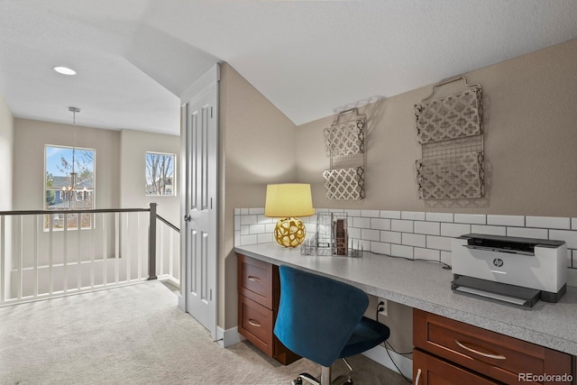 8741 E 29th Ave, Denver, CO 80238 - office featuring light colored carpet, built in study area, vaulted ceiling, and a notable chandelier