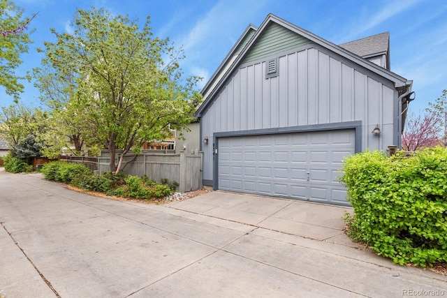 8741 E 29th Ave, Denver, CO 80238 - garage featuring driveway and fence