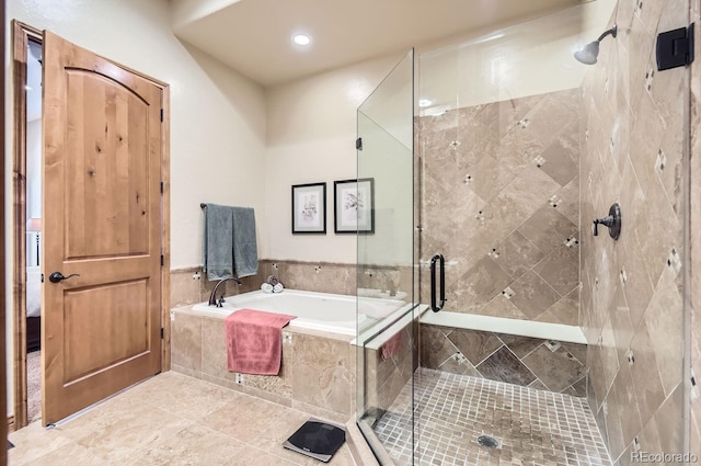 bathroom featuring tile patterned floors and shower with separate bathtub