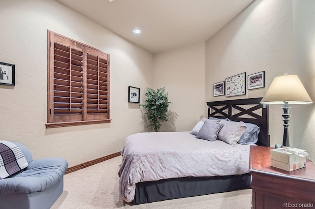 bedroom featuring carpet