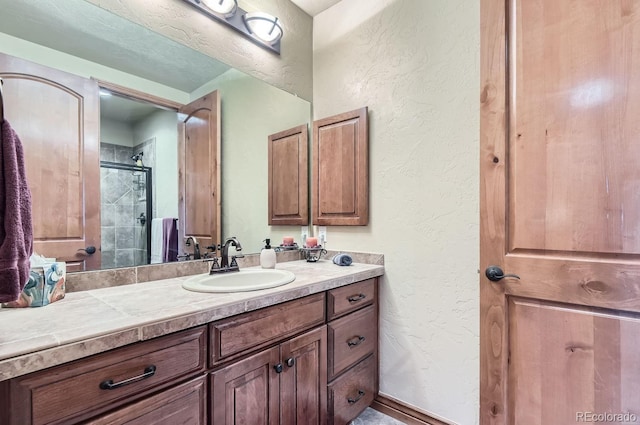 bathroom with vanity and an enclosed shower