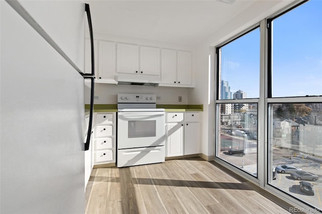 kitchen featuring refrigerator, white cabinets, white range with electric stovetop, and light hardwood / wood-style flooring