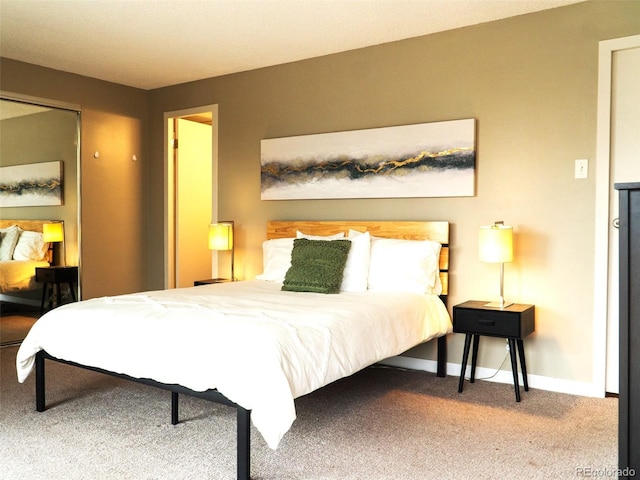 bedroom featuring carpet and baseboards