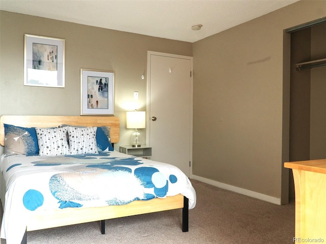 carpeted bedroom featuring baseboards