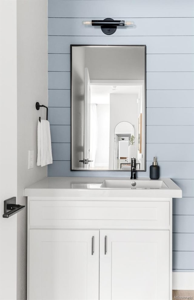 3955 W 13th Ave, Denver, CO 80204 - bathroom with vanity and wooden walls
