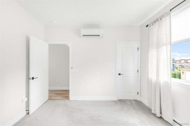 3955 W 13th Ave, Denver, CO 80204 - unfurnished bedroom with a wall mounted AC and light colored carpet