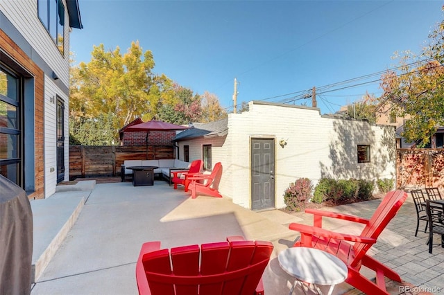 view of patio / terrace featuring outdoor lounge area and fence