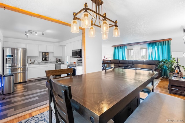 1261 Eagle St, Aurora, CO 80011 - dining area featuring dark wood-style floors