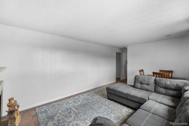 1261 Eagle St, Aurora, CO 80011 - living room with wood finished floors and a textured ceiling