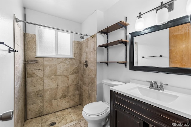 1261 Eagle St, Aurora, CO 80011 - full bathroom featuring vanity, a tile shower, and stone finish floors