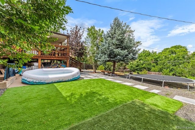 1261 Eagle St, Aurora, CO 80011 - view of yard with a wooden deck, stairway, and a patio