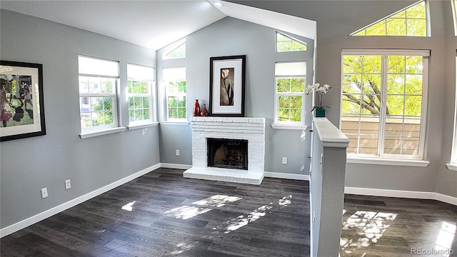 unfurnished living room with a healthy amount of sunlight and dark wood-type flooring