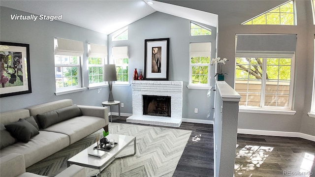 living room featuring dark hardwood / wood-style flooring, a fireplace, and vaulted ceiling