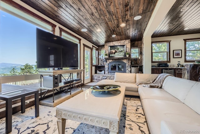 living room featuring wooden ceiling and a fireplace