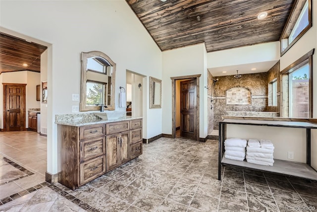 bathroom with vanity, wood ceiling, high vaulted ceiling, and a shower