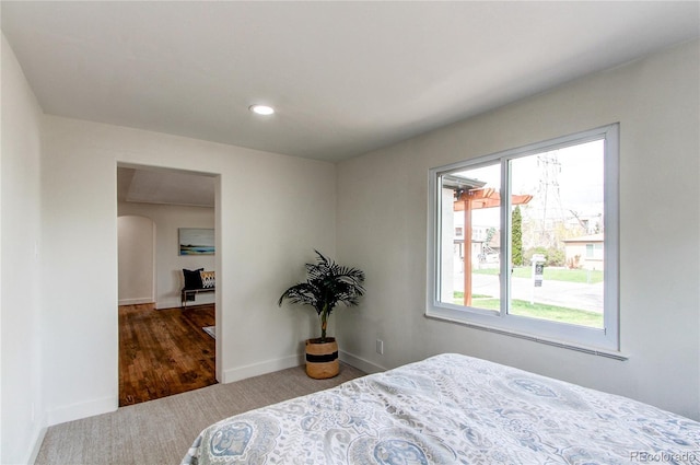 6220 W 11th Pl, Lakewood, CO 80214 - carpeted bedroom featuring arched walkways and recessed lighting