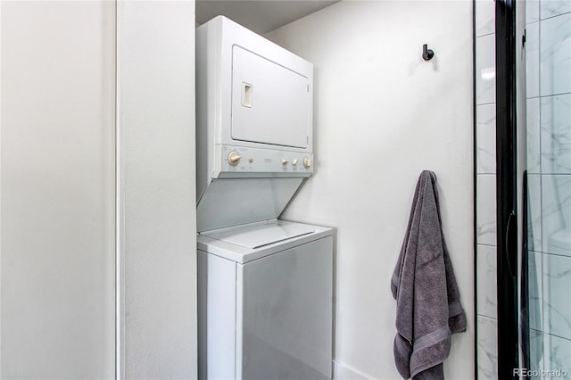 6220 W 11th Pl, Lakewood, CO 80214 - laundry area featuring stacked washer / dryer