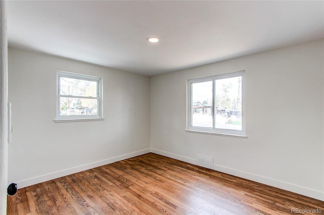 6220 W 11th Pl, Lakewood, CO 80214 - unfurnished room featuring wood finished floors and recessed lighting