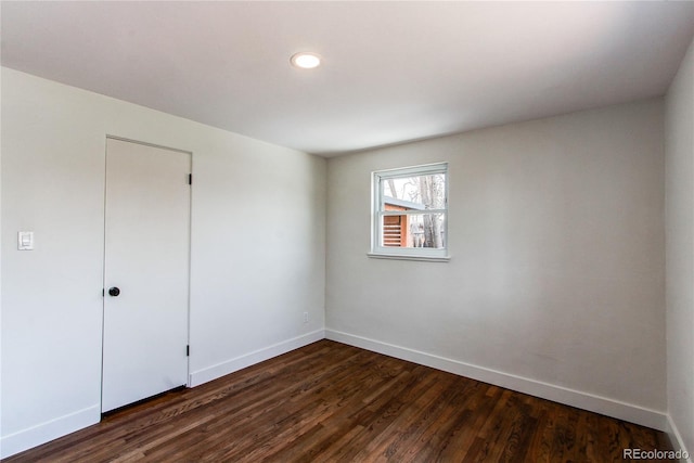 6220 W 11th Pl, Lakewood, CO 80214 - unfurnished room with dark wood-type flooring and recessed lighting