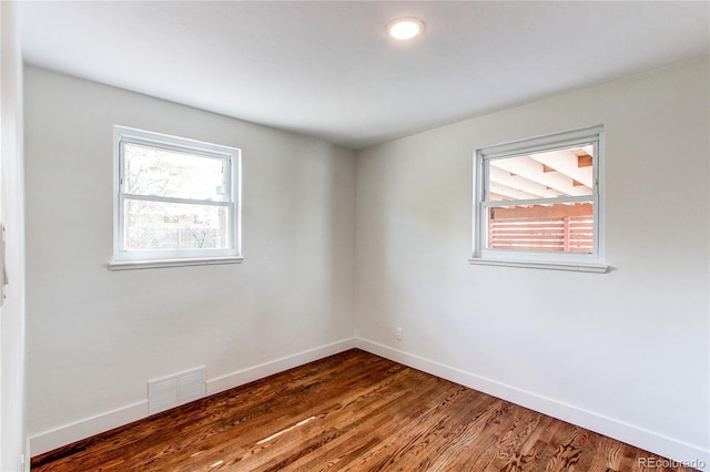 6220 W 11th Pl, Lakewood, CO 80214 - unfurnished room with healthy amount of natural light and wood finished floors