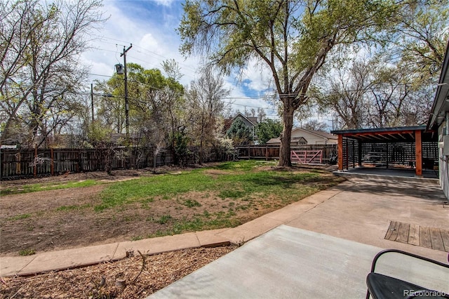 6220 W 11th Pl, Lakewood, CO 80214 - fenced backyard featuring driveway and a carport
