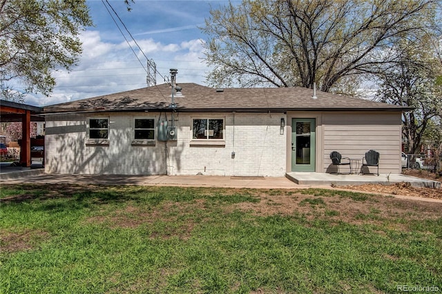 6220 W 11th Pl, Lakewood, CO 80214 - back of property featuring a patio area, a yard, and roof with shingles