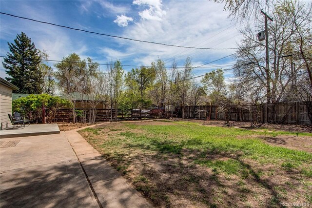 6220 W 11th Pl, Lakewood, CO 80214 - fenced backyard featuring a patio