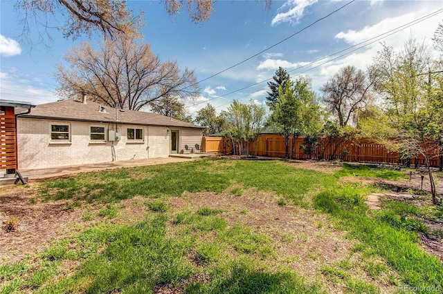 6220 W 11th Pl, Lakewood, CO 80214 - fenced backyard with a patio