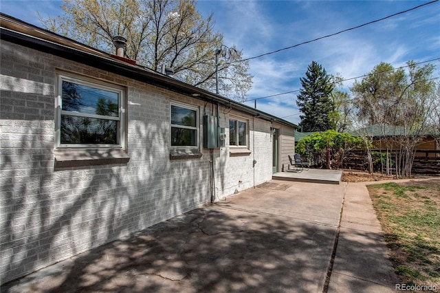 6220 W 11th Pl, Lakewood, CO 80214 - view of property exterior with a patio area and a deck