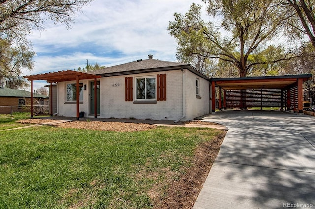 6220 W 11th Pl, Lakewood, CO 80214 - view of front of home featuring brick siding, driveway, a pergola, and an attached carport