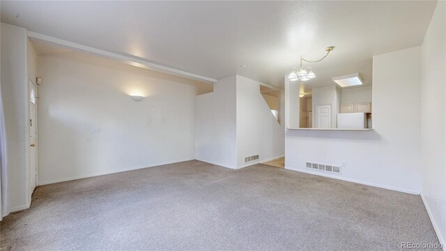 empty room with carpet and visible vents