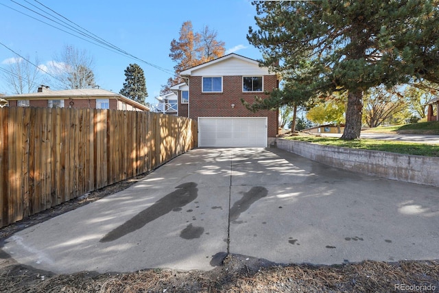 view of side of property with a garage