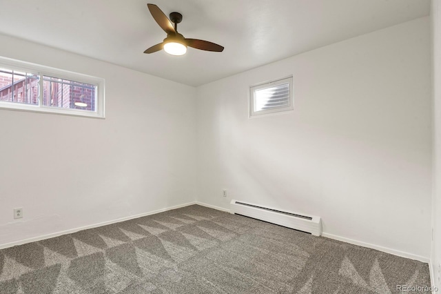 empty room featuring carpet flooring, a baseboard radiator, and ceiling fan