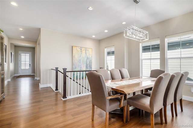 dining area featuring recessed lighting, light wood-style flooring, and baseboards