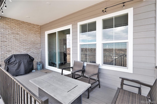 wooden terrace with grilling area