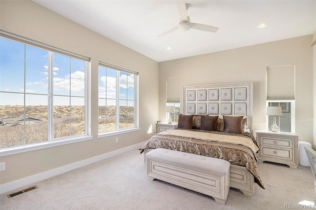 carpeted bedroom with ceiling fan, recessed lighting, visible vents, and baseboards